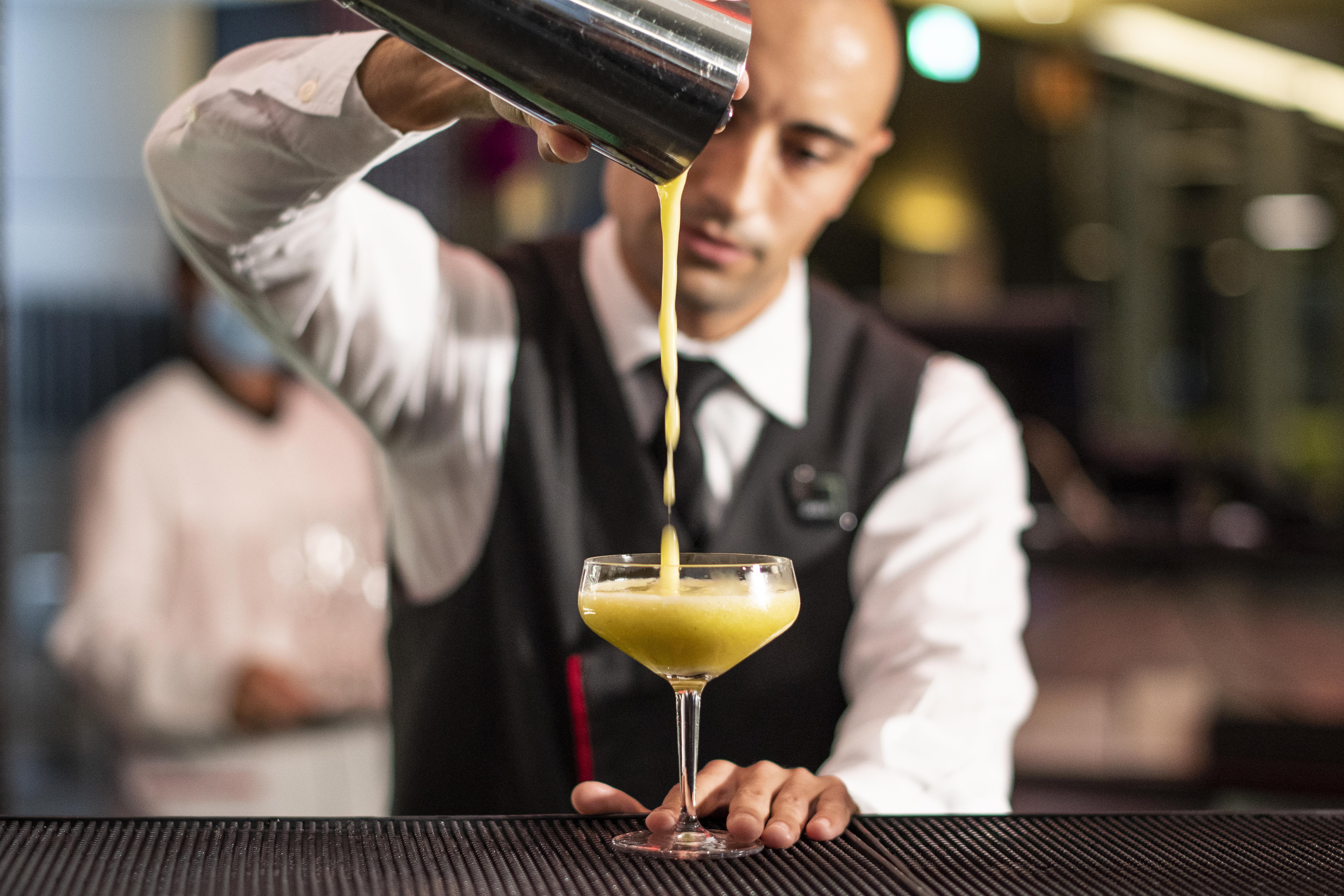 Myriad By Sana Hotels Lisbon Exterior photo A bartender straining a cocktail